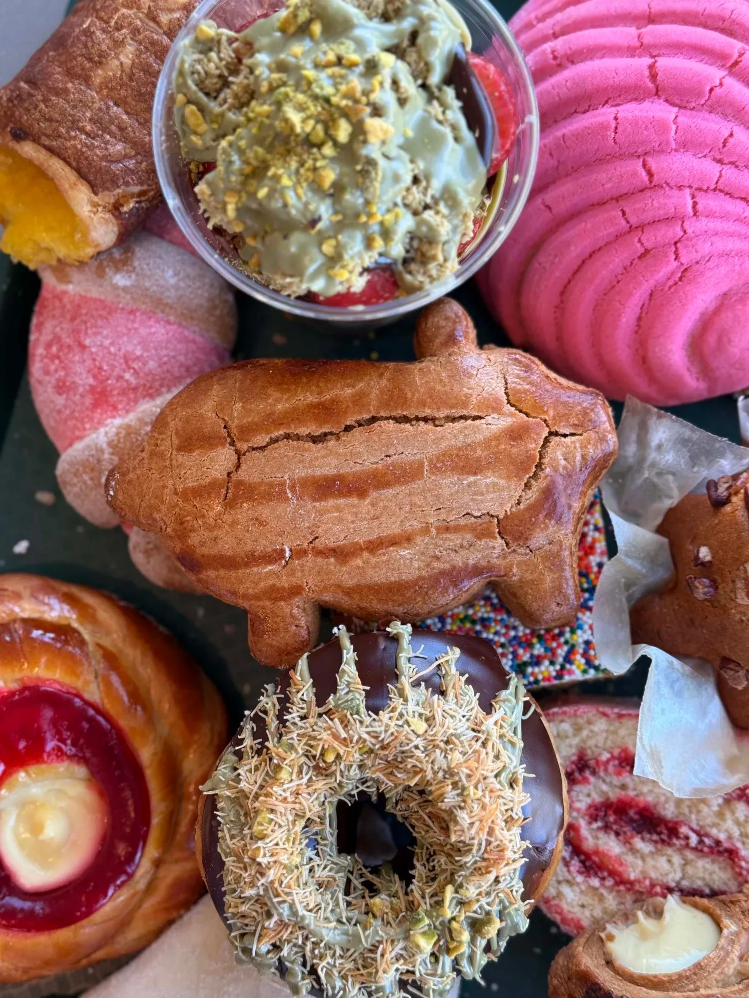 Pig-shaped puerquito among Mexican pastries